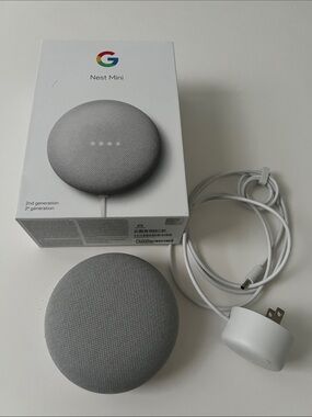 Google Nest Mini 2nd Generation smart speaker with box and cord